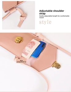Pink leather phone bag detail showing adjustable knotted strap and dual inner pockets