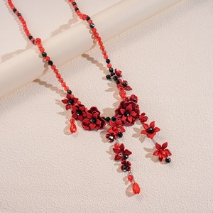 Acrylic floral beaded waist chain with red translucent beads and flower tassels