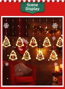 Close-up of LED Christmas curtain lights with warm glowing festive character pendants