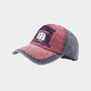 Detailed view of washed cotton baseball cap with New York embroidery and frayed edges