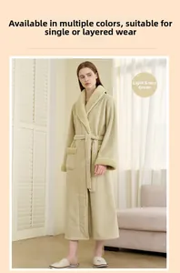 Detail of soft sage green plush bathrobe with tie waist and pocket in a cozy setting