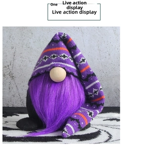 Close-up of Halloween gnome with long purple fur beard and striped knitted hat detail