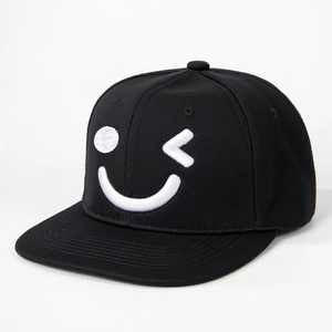 Adjustable black snapback hat featuring a white embroidered wink smiley face design