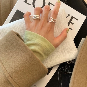 Minimalist French style 925 sterling silver wavy and intertwined rings on hand