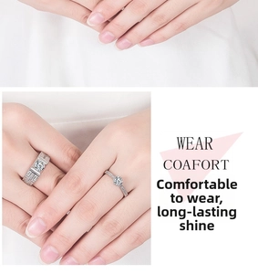 Detail of six-prong moissanite engagement rings for couples in polished silver finish