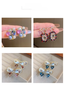 Detailed views of vintage baroque crystal flower earrings with pearls and rhinestones