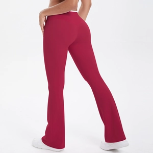 Detail showing high waist design and seamless stitching of the red flare yoga pants