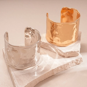 Textured hammered wide cuff bracelet in gold and silver finish on stone plates
