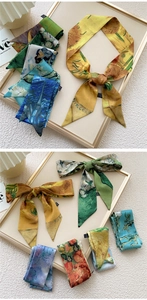 Detail view of long silk scarves featuring Van Gogh oil painting prints like Sunflowers