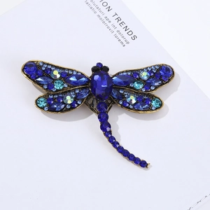 Luxurious dragonfly brooch featuring blue crystals on a vintage gold-plated alloy base