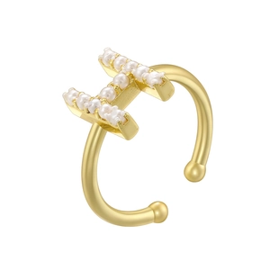 Close-up of elegant gold plated open ring with pearl-inlaid H letter design