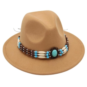 Detail of camel wool felt fedora featuring bohemian beaded band and turquoise stone