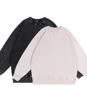Detail of vintage oversized crewneck sweatshirts in charcoal and beige washed cotton
