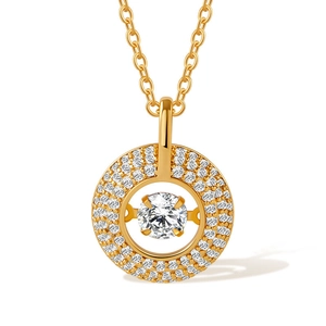 Macro shot of gold pendant featuring a sparkling diamond halo around a central stone
