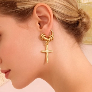Gold stainless steel cross hoop earrings with beaded rings shown on a model side profile