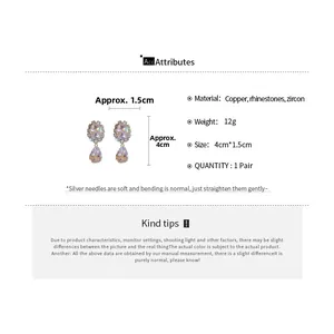 Detailed view of silver needle drop earrings featuring clear cubic zirconia and dimensions