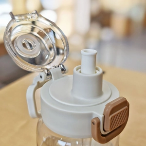 Modern large capacity sports straw water bottle with secure locking lid and carry handle