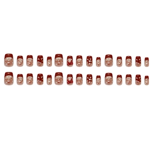 Burgundy cat eye press-on nails set with glitter floral patterns and white polka dots