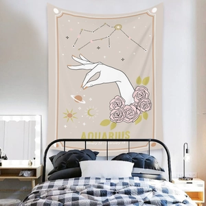 Detail of Aquarius astrology wall tapestry with roses and stars hanging in a bedroom