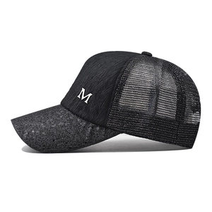 Fashionable black mesh baseball cap with silver metal M logo and textured sequin brim