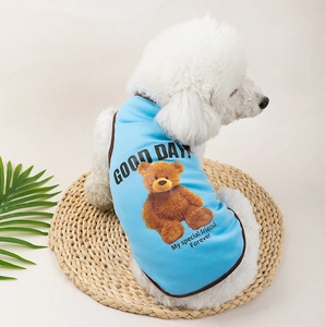 Detail of breathable light blue mesh pet vest with teddy bear print and brown trim