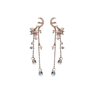 Rose gold moon and star earrings with pearls and crystal fringe on white background