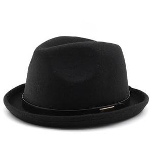 Close-up of black wool felt fedora featuring a leather band with gold buckle detail