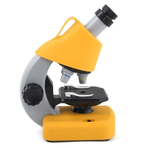 Portable biological science microscope for kids in bright yellow with stable base stand