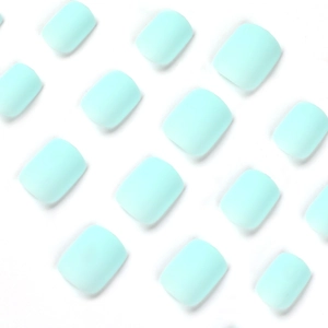 Matte mint blue short square press-on nails arranged in a neat grid pattern on white