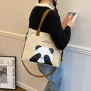Asian model wearing large panda canvas tote bag with shoulder strap and panda illustration