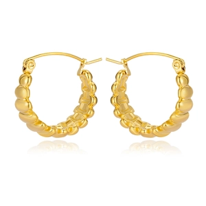 Macro shot of gold stainless steel earrings with textured bubble pattern and mirror reflections