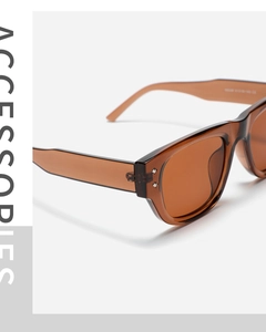 Detailed macro view of retro amber square sunglasses frame with CE marking on temple