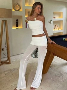 Detailed texture of white ruched tube top and lightweight flare pants set