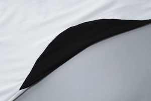 Détail du contraste de tissu noir et blanc et de la texture en maille de haute qualité