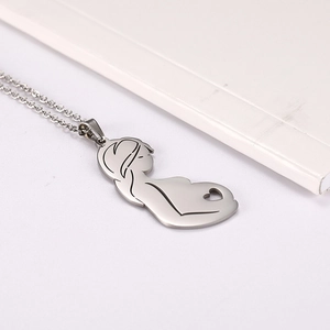 Detail of silver stainless steel necklace featuring a minimalist mother and child pendant