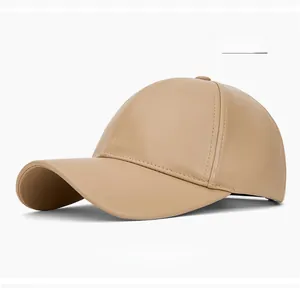 Close-up of premium beige PU leather baseball cap with detailed stitching and texture