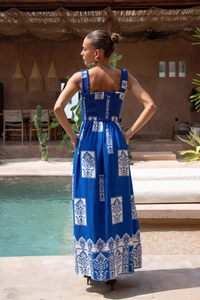 Detailed back view of navy blue printed maxi dress with bohemian patterns and smocked detail