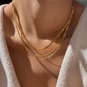 Three-layer gold-plated layering necklace set with snake, rope, and box chain styles