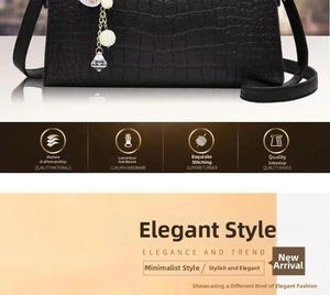 Detail of black embossed faux leather handbag with pearl tassel and fine hardware