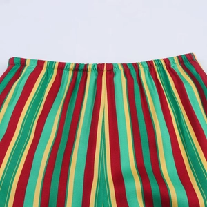 Detailed macro view of the elastic waistband on striped pajama pants with vivid colors