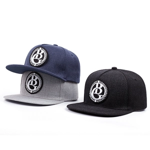 Three flat brim hip hop caps in navy, grey, and black featuring circular BG embroidery