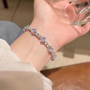 Detail of square-cut cubic zirconia stones set in a silver-tone tennis bracelet