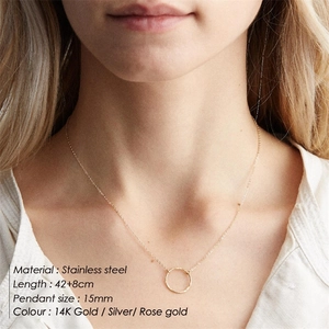 Double-layered stainless steel necklace with round geometric pendant in 14K gold finish