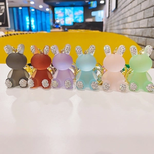 Set of 6 colorful resin rabbit keychains with frosted texture and glitter diamond accents
