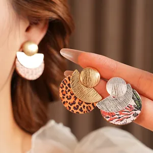 Minimalist round geometric wood earrings with leopard print and brushed metal accents