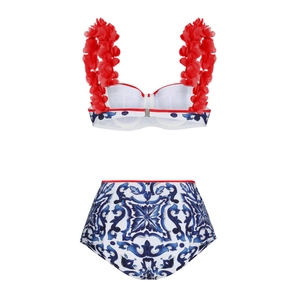 Detail of white bikini top with 3D red floral straps and Majolica printed bottoms