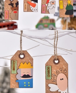 Detail of wooden Christmas tags featuring reindeer and Santa with jute hanging ropes