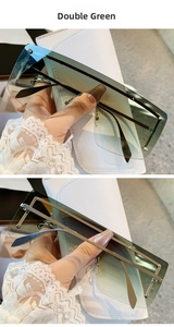 Detail of green oversized rimless sunglasses with decorative metal studs and white leather case