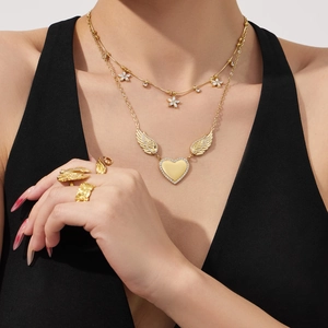 Gold stainless steel layered necklace set with flower and angel wing heart pendants