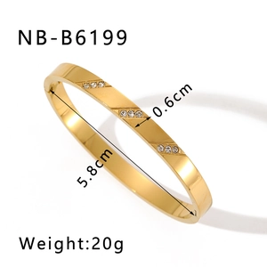 Detailed view of gold stainless steel bangle with rhinestone accents and size dimensions